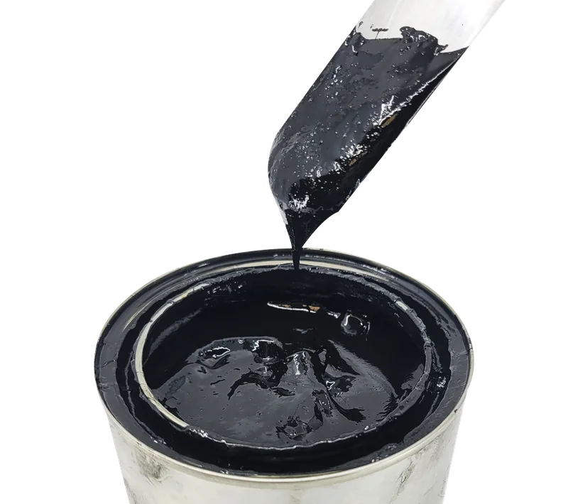 A blade lifts black open-gear grease from an open pail.